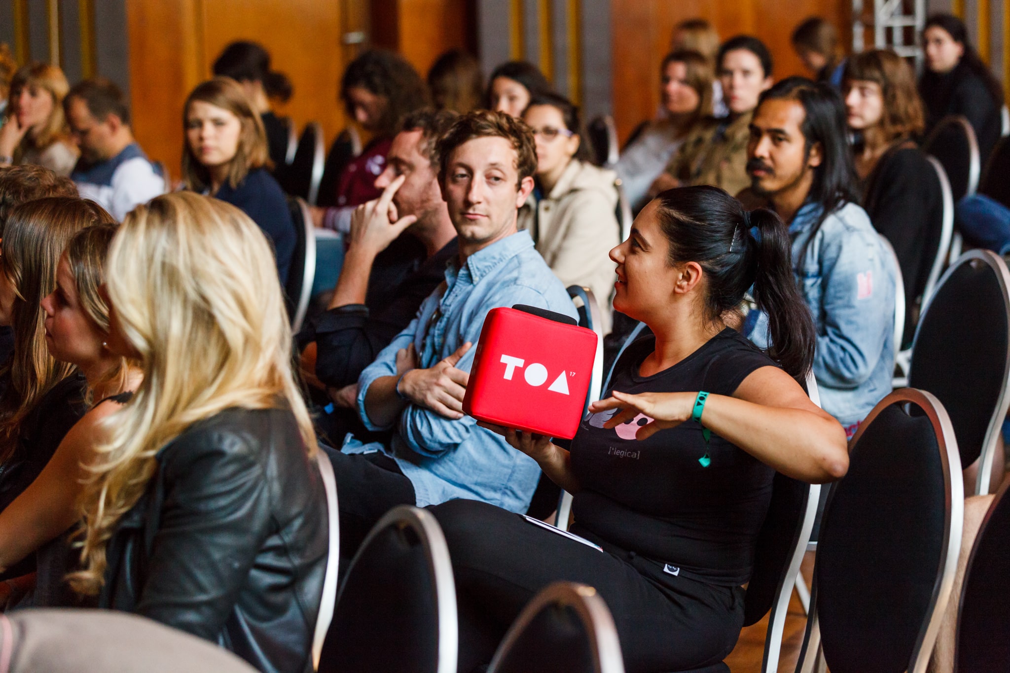 Audience engaging in conversation with Catchbox Plus Cube microphone